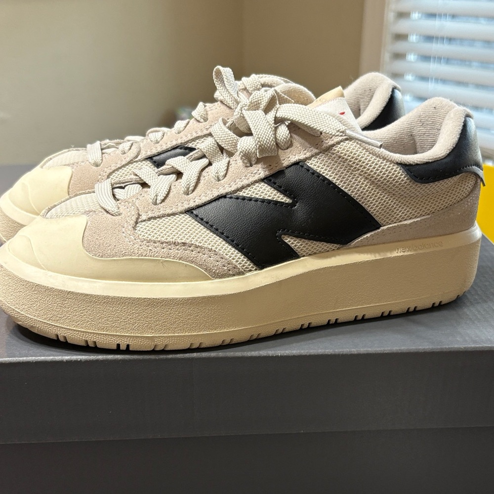 New Balance women’s Beige and Black Sneakers